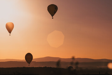hot air balloons at sunset - freedom and adventure concept