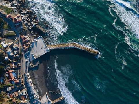 Drone Shot Of A Small Beautiful City By The Sea