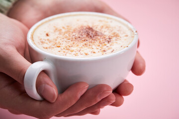woman with cup of cappuccino