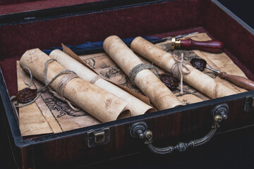 Vintage wooden suitcase with scrolls with wax seal, old map, seal.