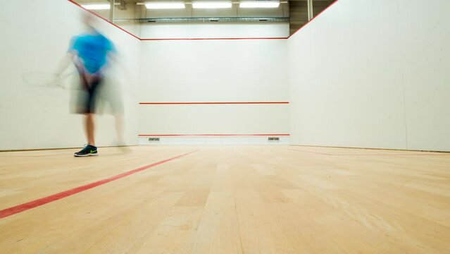 Squash match between two professional squash player, static time-lapse shot