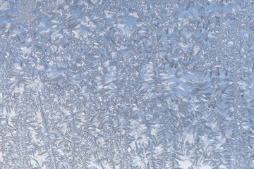 Winter frost covering old fashion window glass.
