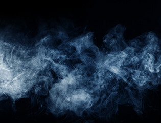 Abstract smoke texture over black. Fog in the darkness.