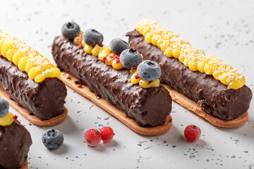 Cold chocolate bar with berries on biscuits