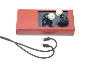 In-ear headphones for Hi-Fi music player. Audio sound and modern equipment for music lovers and...