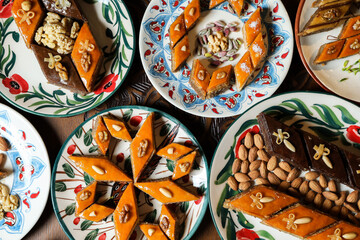 Traditional Turkish holiday Novruz spring holiday green semeni, traditional azerbaijan sweets, shekerbura, qogal, paxlava, mutaki and different nuts and sweets, top view, sweet stuff and Turkish sweet
