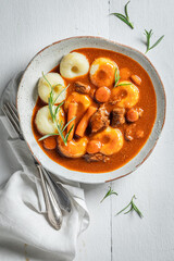 Silesian noodles with goulash made of vegetables and beef