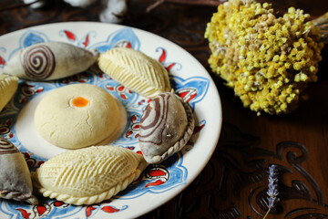 Traditional Turkish holiday Novruz spring holiday green semeni, traditional azerbaijan sweets, shekerbura, qogal, paxlava, mutaki and different nuts and sweets, top view, sweet stuff and Turkish sweet