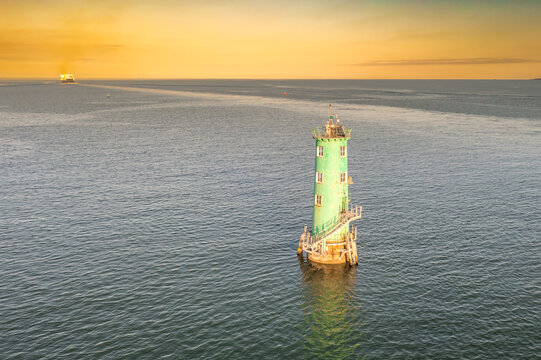 North Bull Lighthouse in Dublin Harbor Ireland at sunset seen from above
