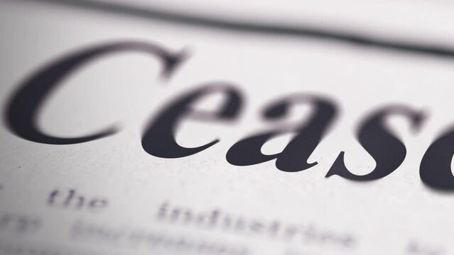Close up Footage of Ceasefire written newspaper close up shot to the text.