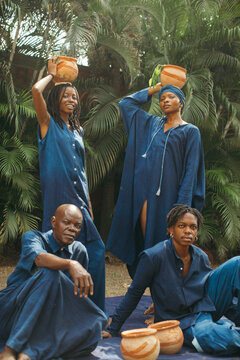 Portrait of group of african eco fashion designers standing together
