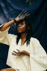 Portrait of a young african indigo eco fashion designer - obrazy, fototapety, plakaty