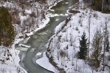 Fototapeta na wymiar Aerial view of riverbank in the winter morning of the rural park.