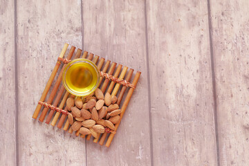 almond oils and fresh nuts on table 