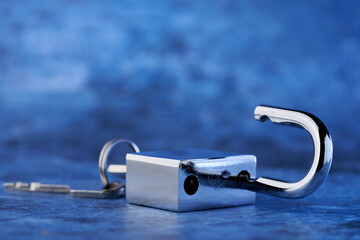  small brass padlock with key illustrates the key to unlocking success