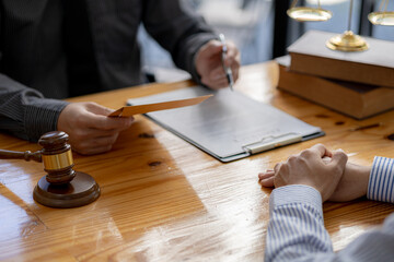 Client was listening to a lawyer advising on an embezzlement case, explaining the details of the...