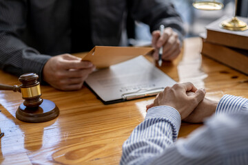 Client was listening to a lawyer advising on an embezzlement case, explaining the details of the...