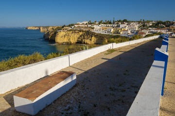 terrace and low wall above the Carvoeiro Sandy beach between cliffs and rocks, Algarve, Portugal