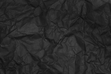 black crumpled paper texture as background