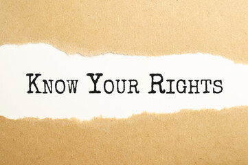 Fototapeta na wymiar Know Your Rights Message text written behind a torn paper