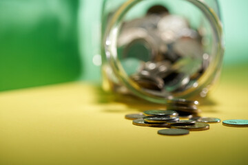 savings jar against green background
