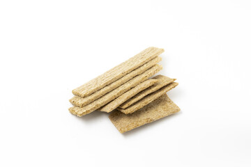 a bunch of dried wheat diet light brown breads on a white background isolated top view