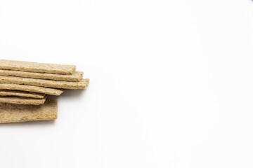 Several dry wheat diet light thin breads on a white background isolated