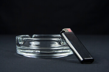 Glass ashtray for smoking a pipe. On a black background