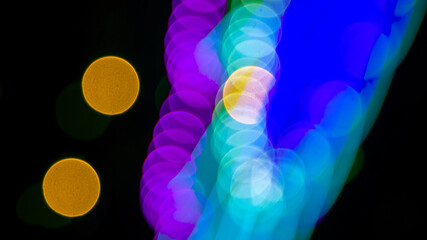 background blurred abstraction of colored lanterns and decorations. bokeh texture of street colored lights