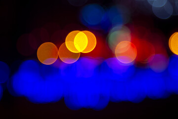 background blurred abstraction of colored lanterns and decorations. bokeh texture of street colored lights