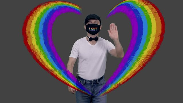 Gay man in anti covid lgbt mask walks greeting people, heart-shaped animation, alpha channel included in 4k footage