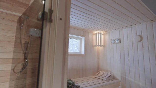 Wooden bath. Steam room in a traditional sauna.