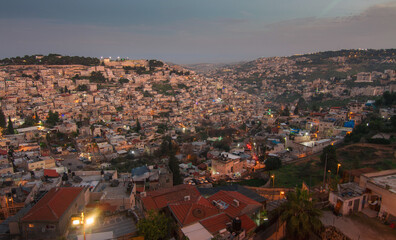 Fototapeta na wymiar Arab neighborhoods in Jerusalem. Gehenna valley at evening