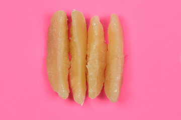Perfectly retouched pomelo on pink background.