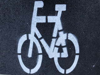 Bicycle lane sign painted on the street