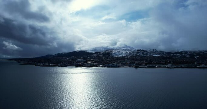 Moody arial view over Sortland in Northern Norway, North Scandinavia, ascending pedestal shot - Lang&oslash;ya.
