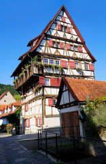 old timber-framed houses by the turquois pond called Blautopf (Blue Pot) in Blaubeuren (Germany)	
