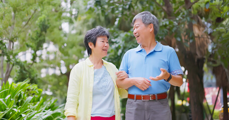 Naklejka premium elder couple walk outdoor