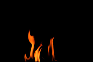 Close up burning flames on black background for graphic design or wallpaper