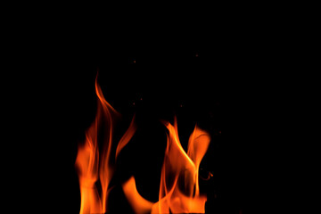 Close up burning flames on black background for graphic design or wallpaper