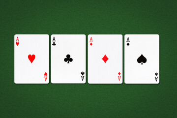 Four aces, different suits on a dark green poker background. Gambling background.