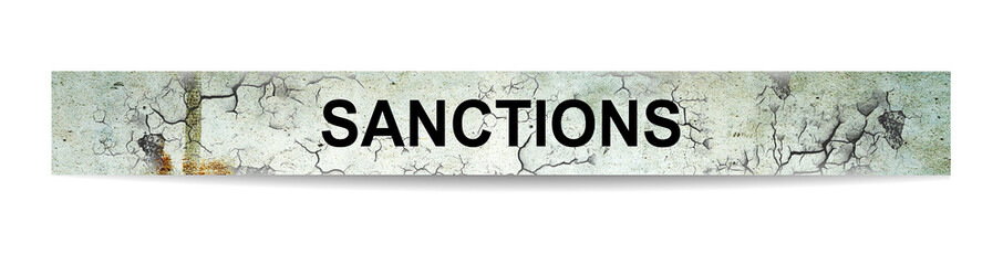 Sanctions, word on cracked concrete. Isolated on white background.Economic and political sanctions.