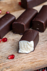 dessert of creamy filling and chocolate on a board