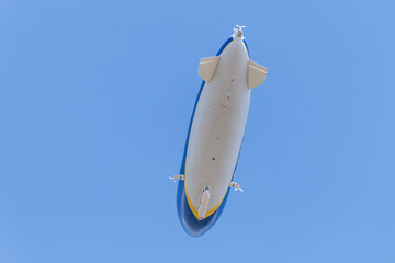 Fototapeta premium Zeppelin flying over the sky - In summer sky - Denmark