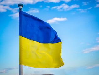 Ukrainian flag blowing from a flag pole
