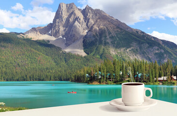 Cup of coffee in the morning in an Emerald lake and Rocky Mountains (Yoho National park. Alberta....