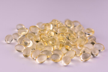 Many vitamin D capsules. Close-up.