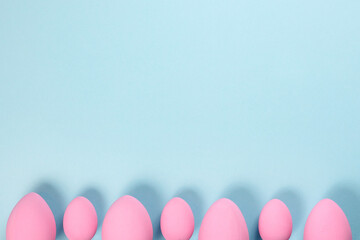 Pink Easter eggs on a blue background