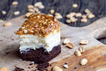 Fototapeta na wymiar creamy chocolate cake with caramel and roasted peanuts