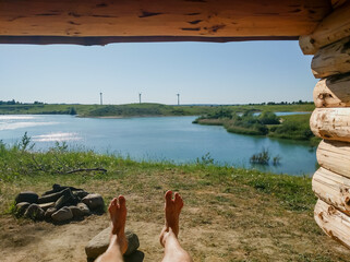 Early spring in Denmark - relaxing in a outdoors shelter near lake at sunny weather - Roskilde city